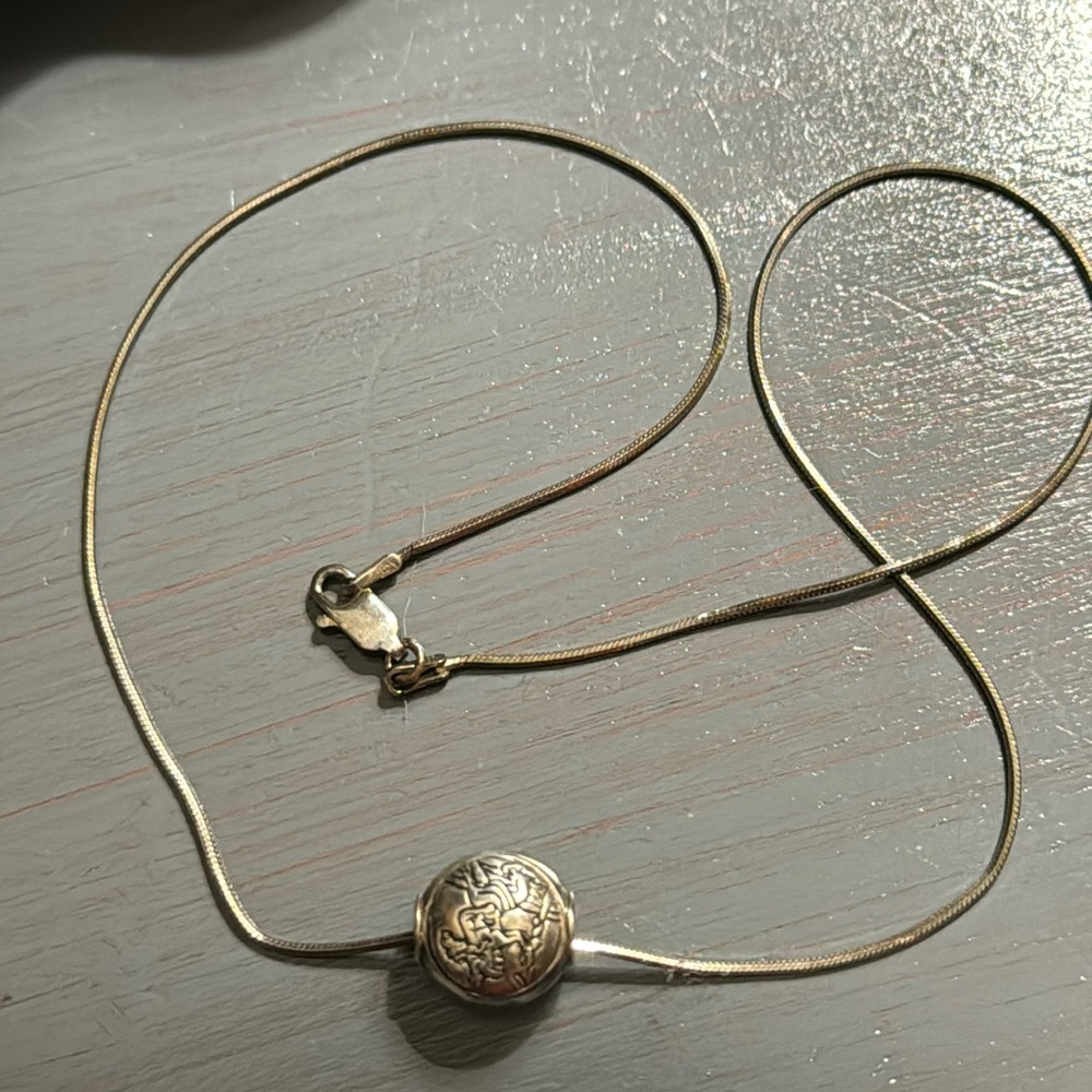 Sterling silver bead with sterling silver chain.